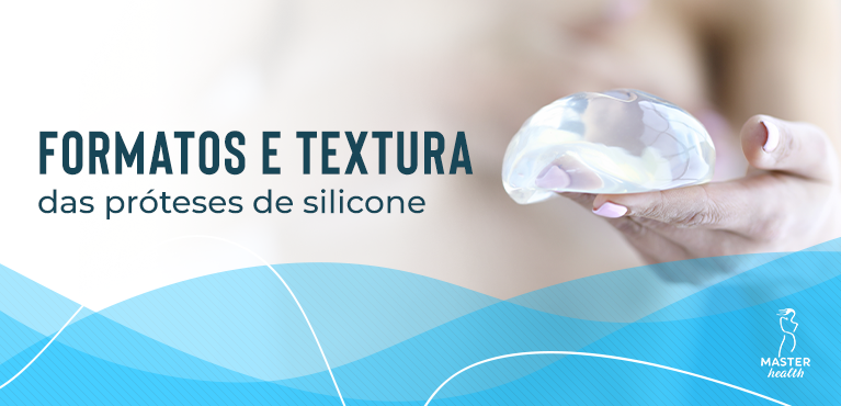 mão segurando uma prótese para mostrar o formato de silicone